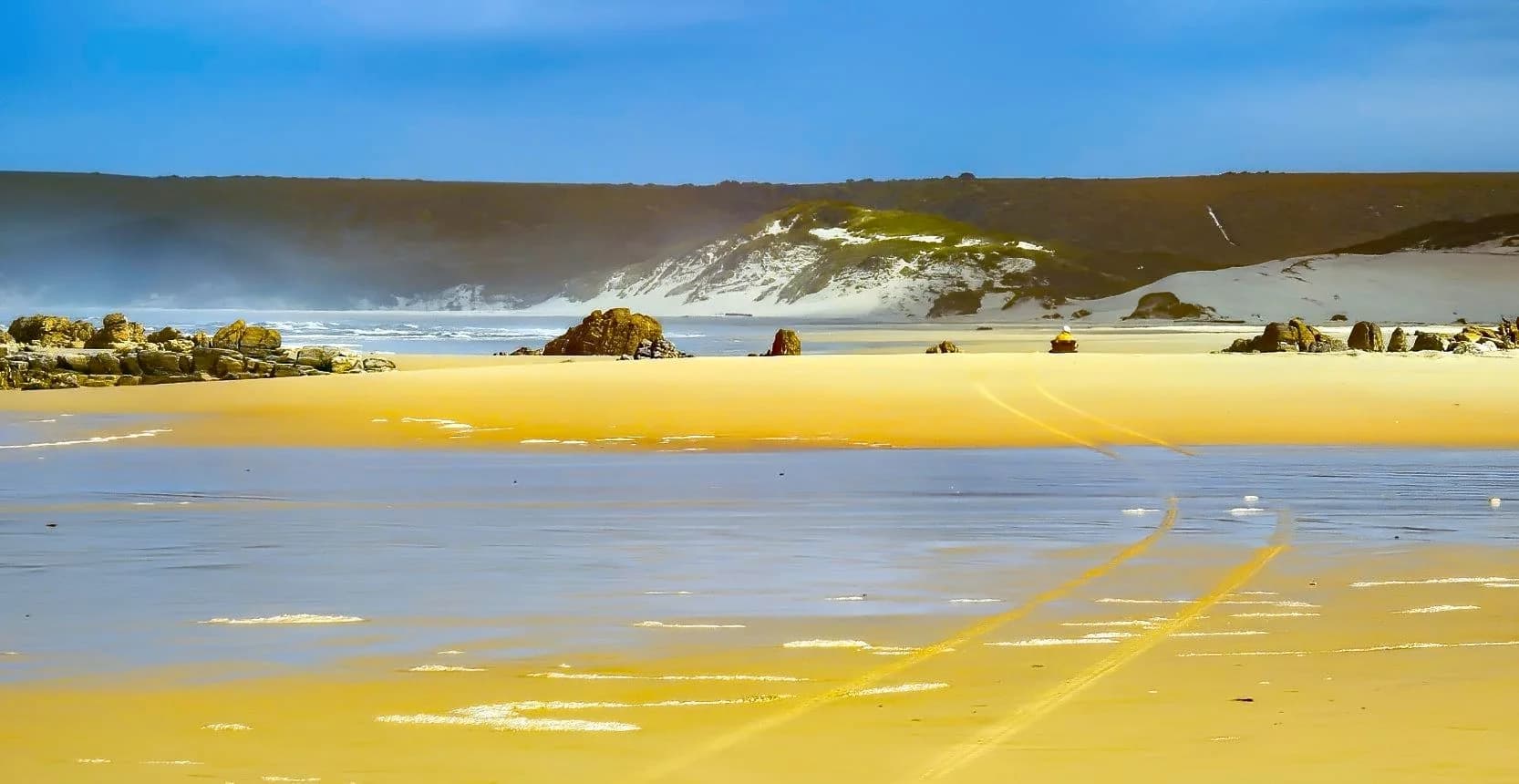 Sand, dune and surf on the west coast of Tasmania