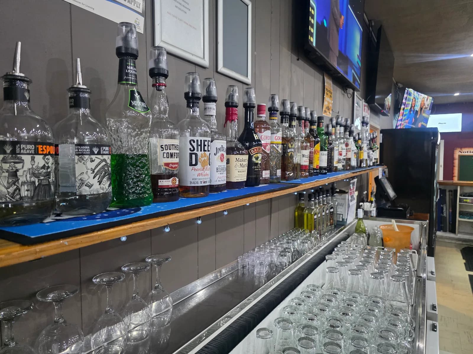 The spirits shelf behind the public bar