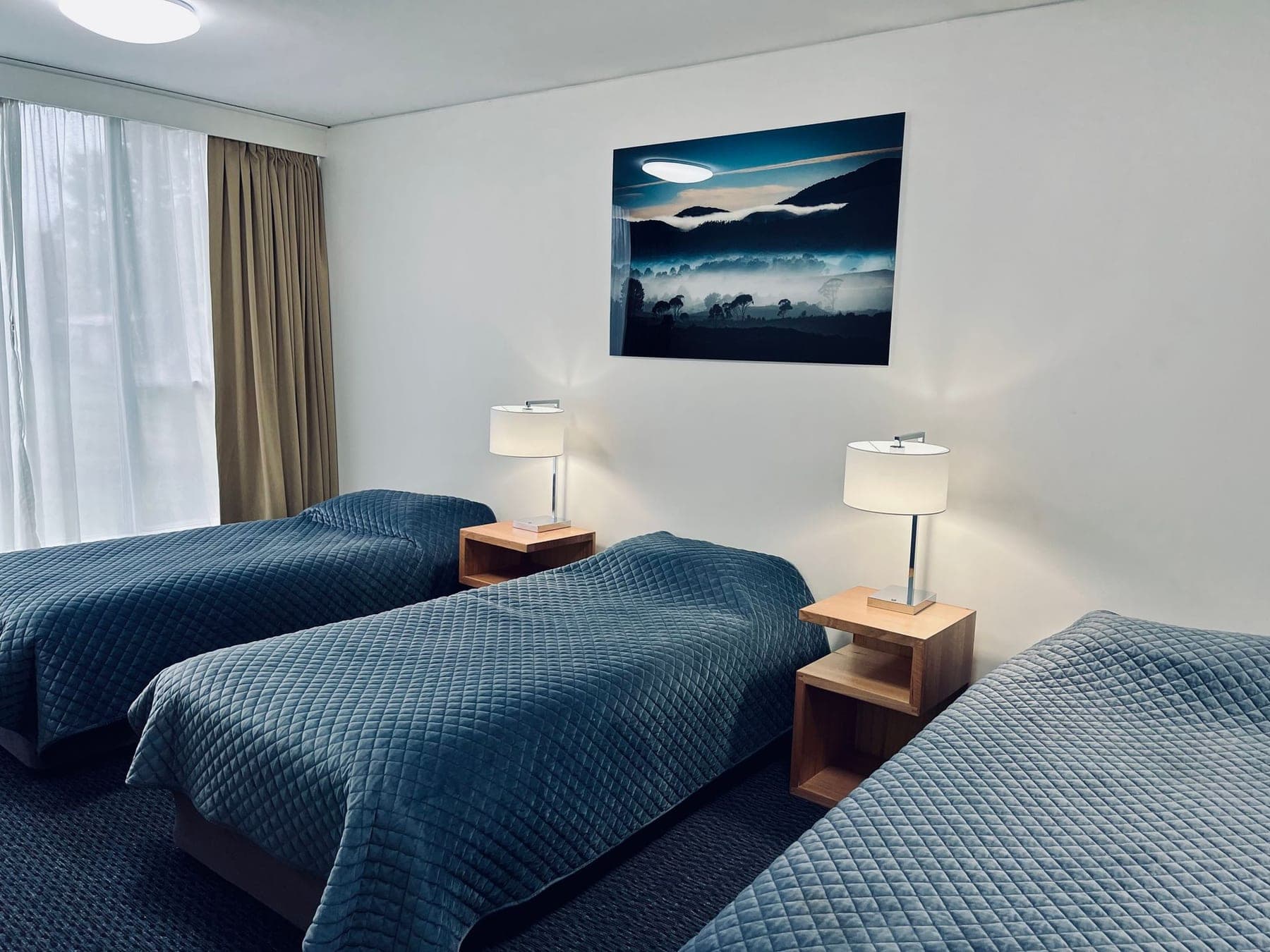 Second bedroom with 3 single beds in the adjoining 2 bedroom room at the Heemskirk Motor Hotel