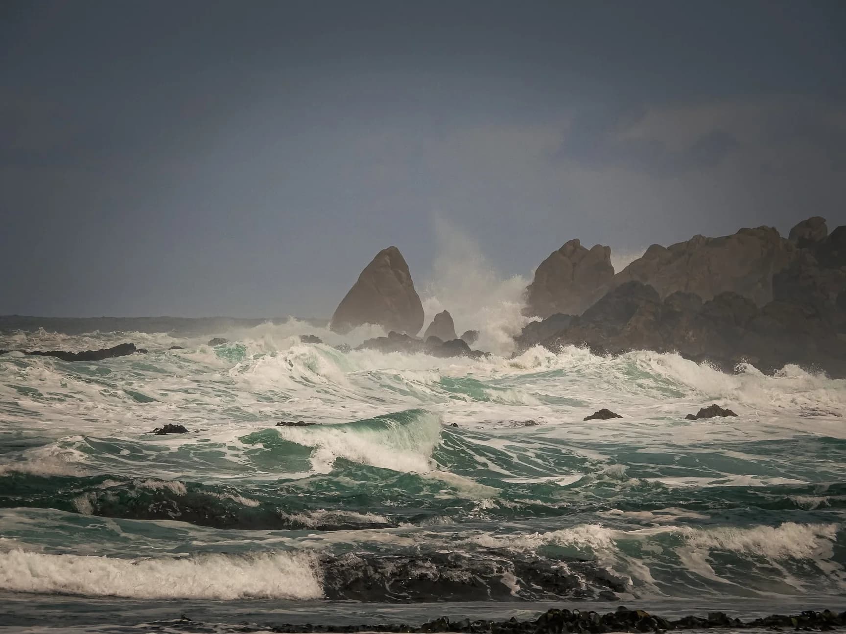 Surf breaking on the rocks at Trial Harbour, West Coast Tasmania